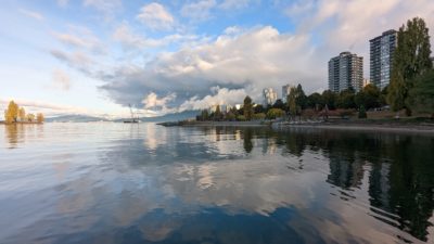 Sunset Beach and West End reflected in water