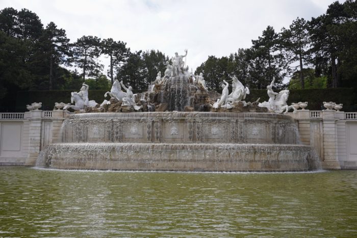 Poseidon Fountain, a pretty stone fountain and pond with mermen and horses