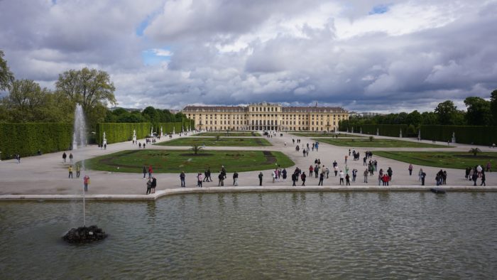 View of Schönbrunn grounds, a carefully manicured garden, and the palace in the background