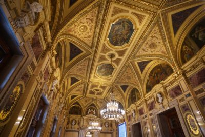 Fancy intermission room decorated in Baroque gold, with busts