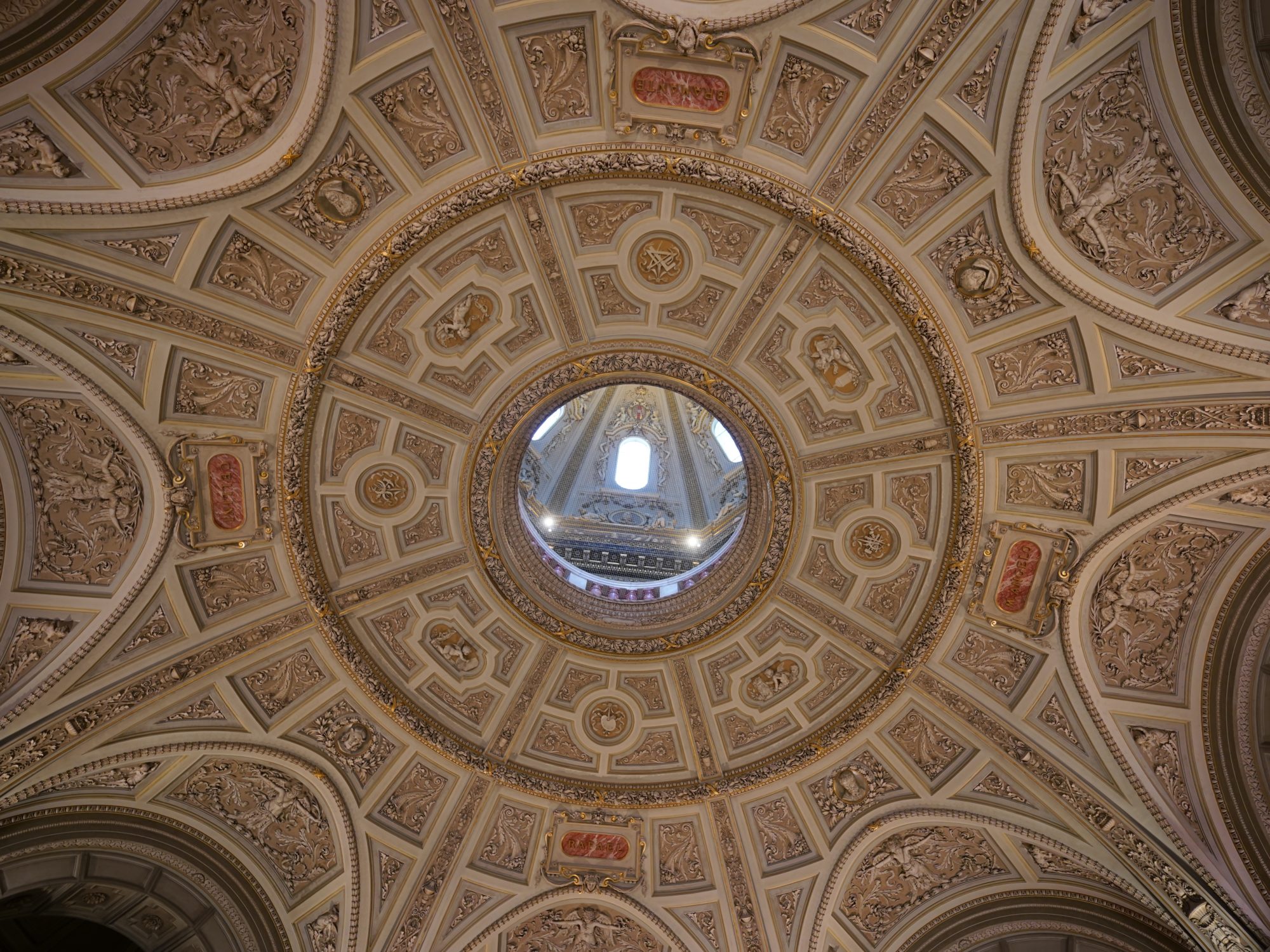 A cupola or dome, open in the centre so we can see a little of the ceiling above