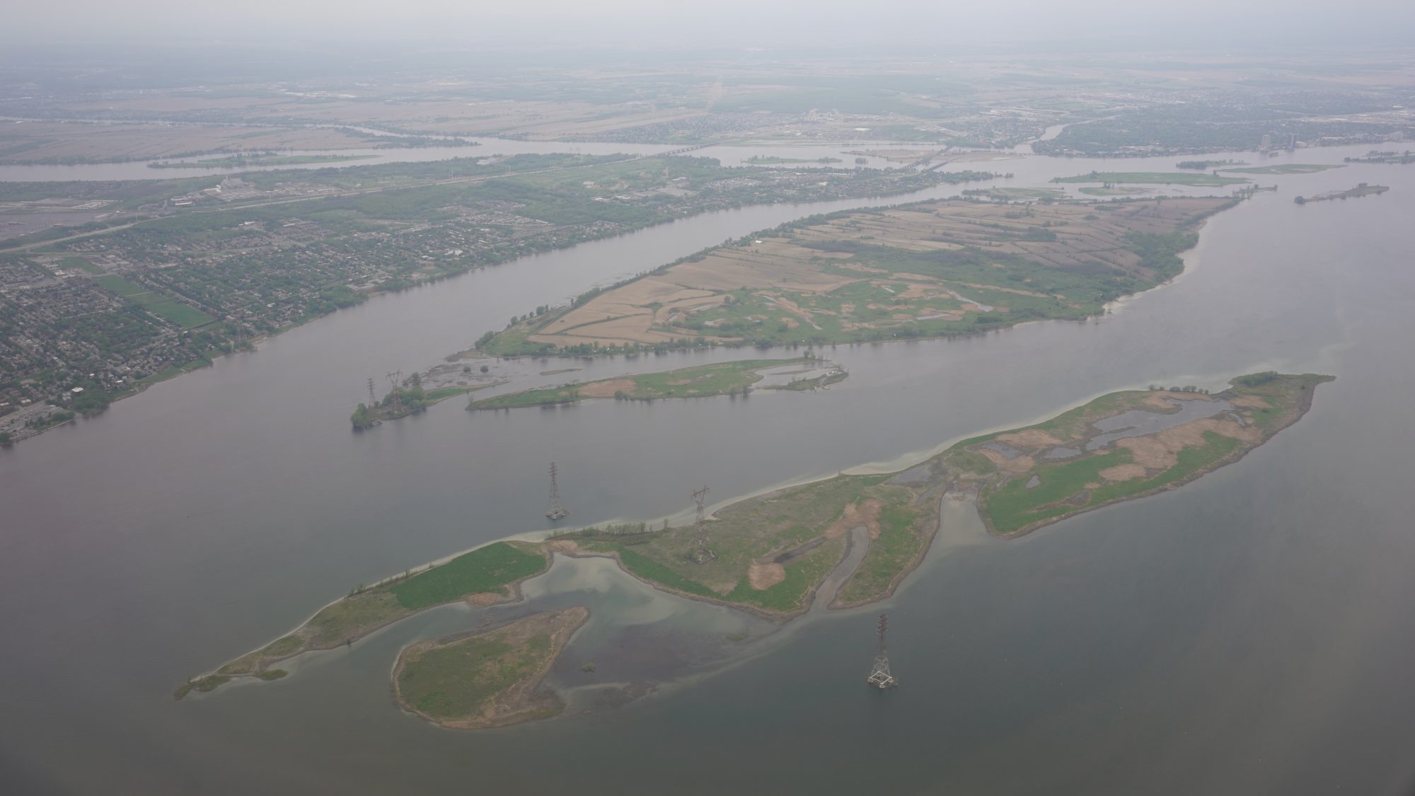 Two large islands southeast of Montreal Island.