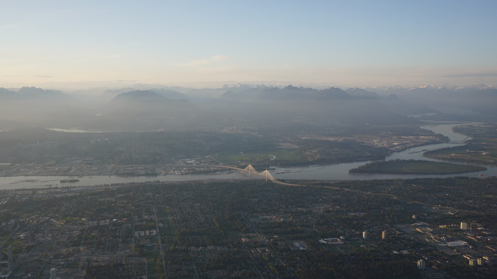 A view of the Fraser River, with mountains as backdrop
