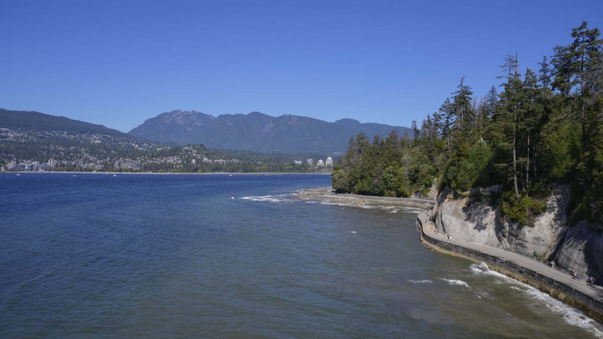 Part of the Stanley Park Seawall, and North Vancouver in the background